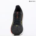 Laufschuhe Damen Mizuno Wave Rider 28 black/evening primrose/poppy red 9