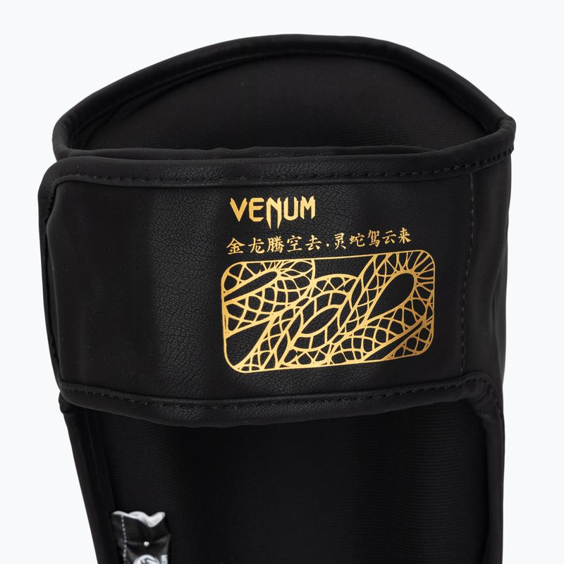 Schienbein- und Spannschoner Venum Serpenti black/silver/gold 7