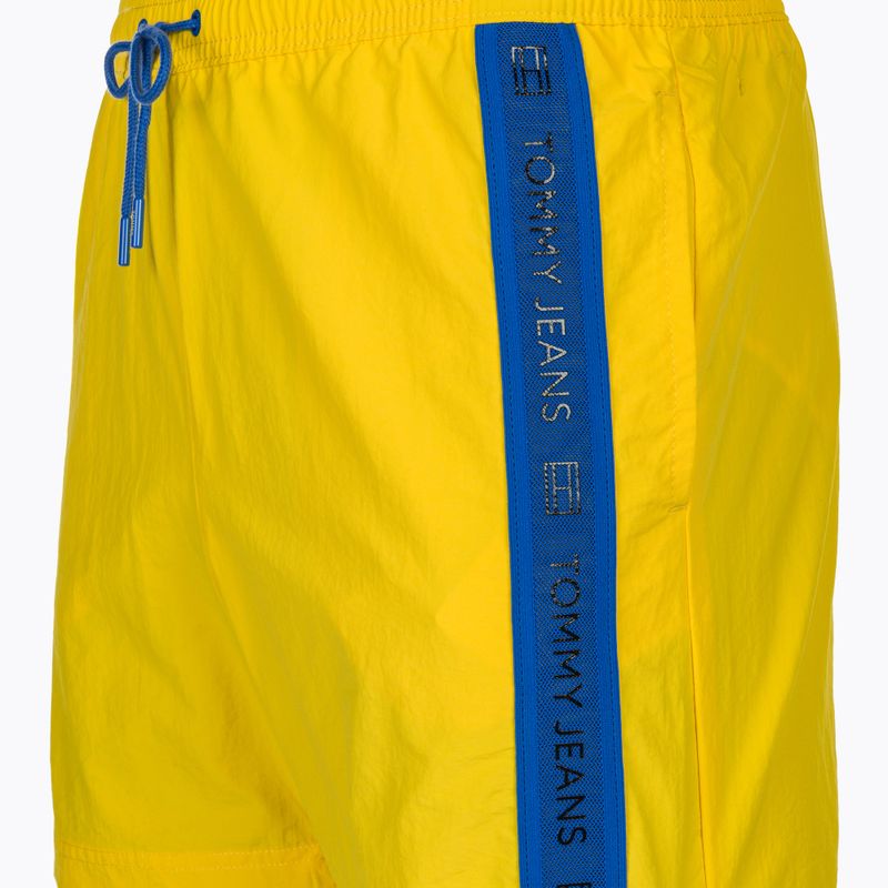Herren Tommy Jeans SF Medium Drawstring Side Tape Badeshorts lebendig gelb